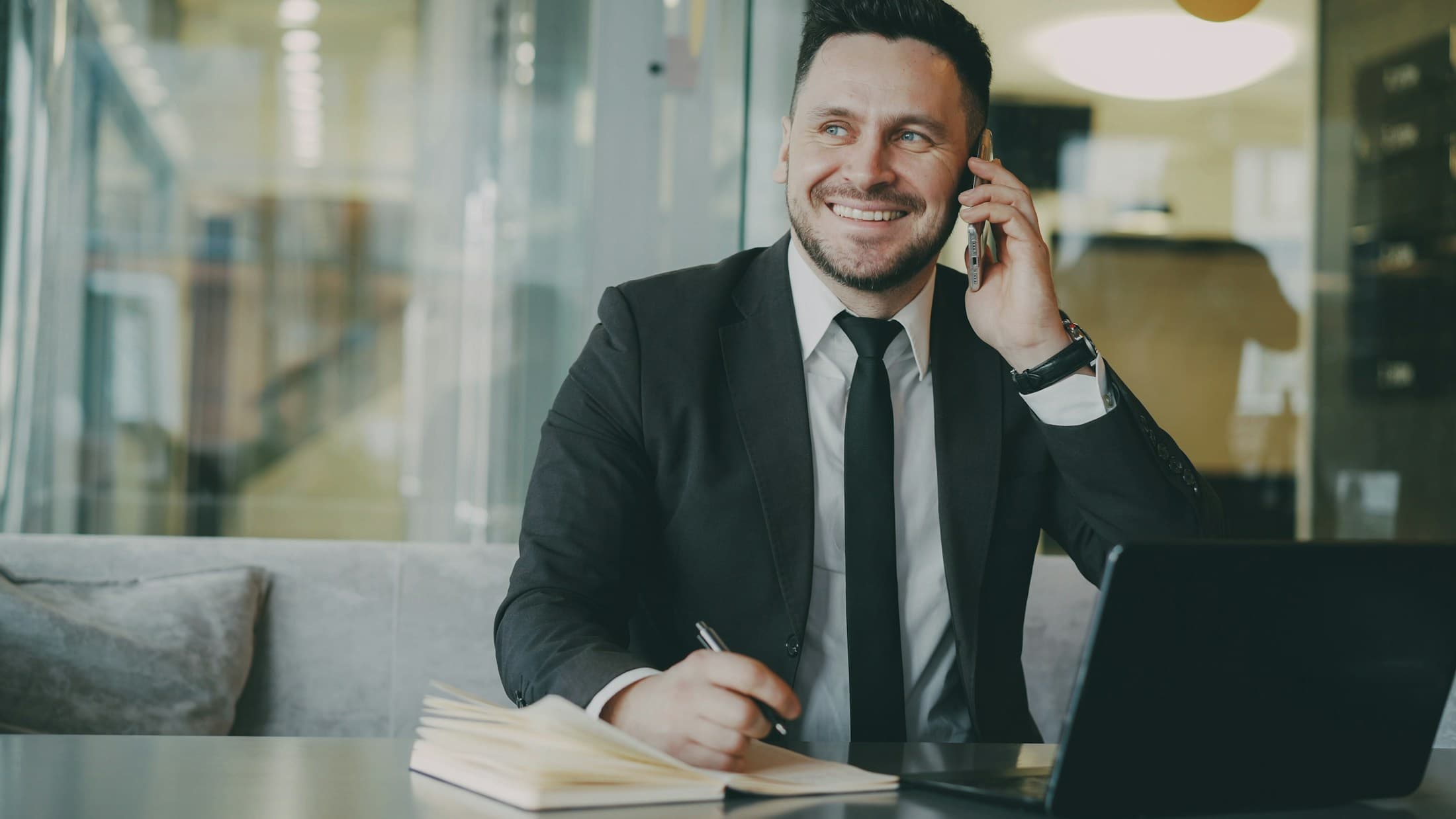 Investor confirming a structured withdrawal from his office desk.