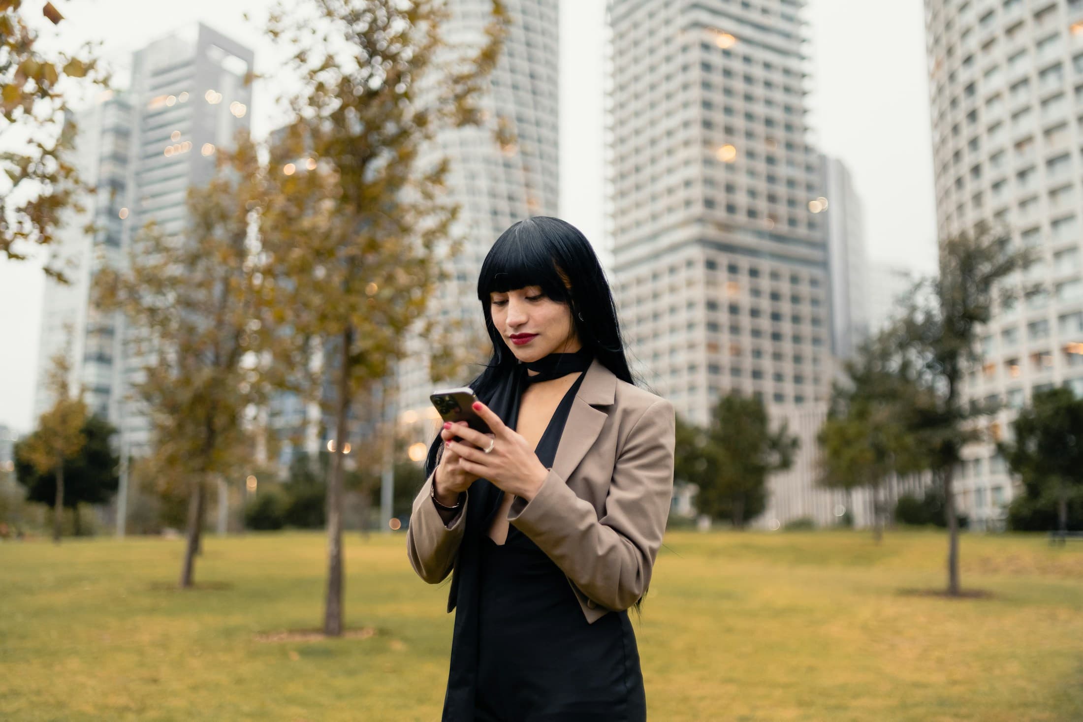 Investor checking live sector yields on her phone in the city.